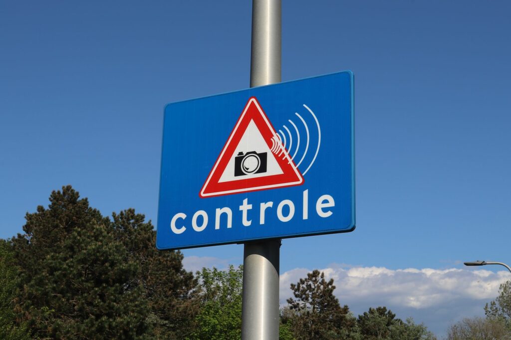blue traffic sign warning of speed control