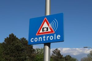 blue traffic sign warning of speed control