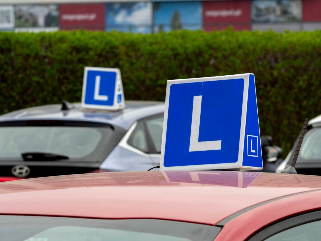 driving school vehicle with learning sign